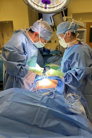 Two cardiothoracic surgeons performing surgery